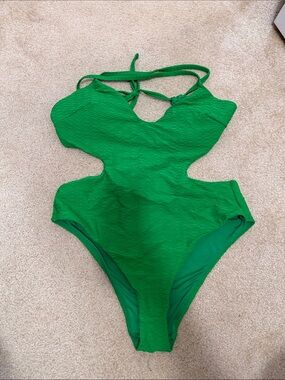 Victoria's Secret Green Textured Cutout One-Piece with matching skirt cover up.